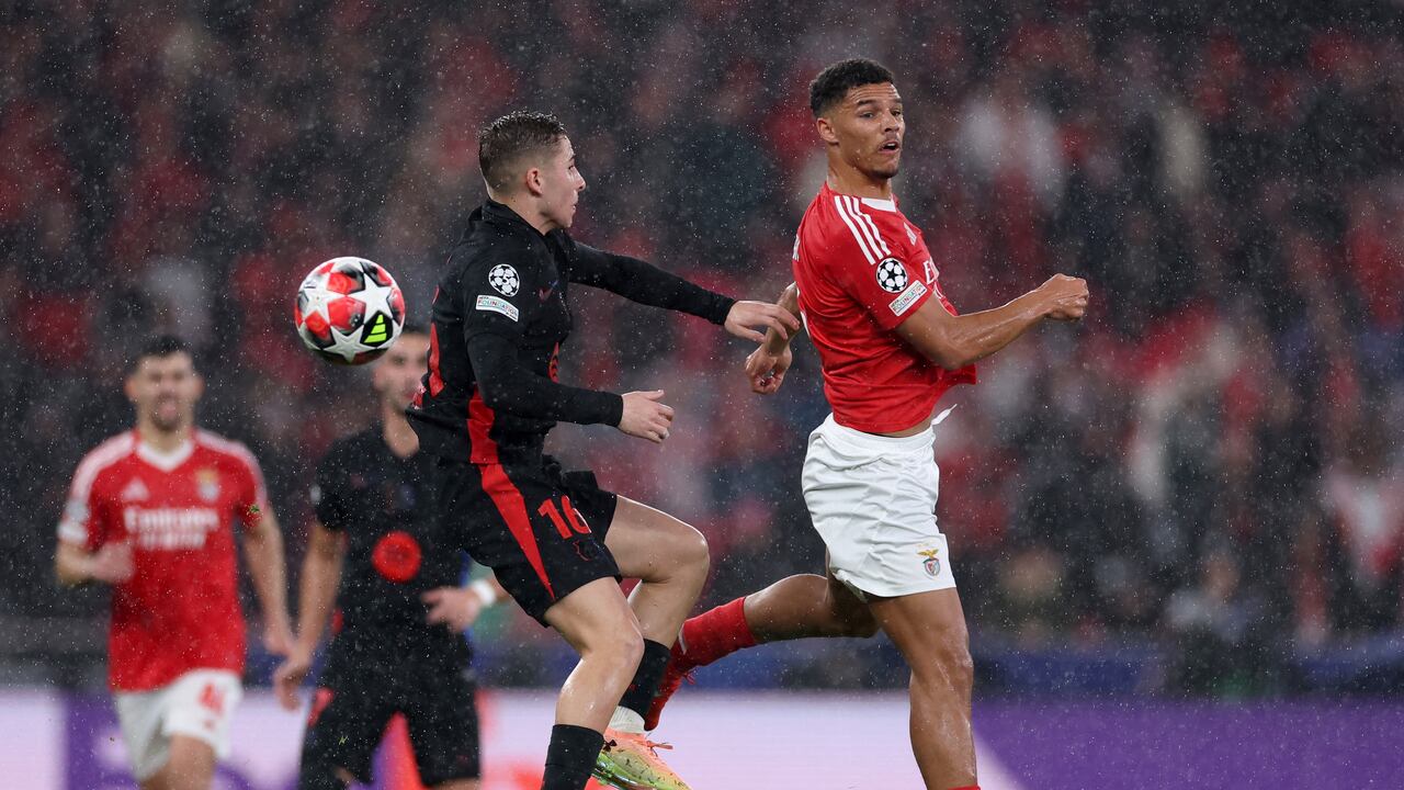 Barcelona's Spanish midfielder #16 Fermin Lopez fights for the ball with Benfica's Danish defender #06 Alexander Bah during the UEFA Champions League, league phase football match between SL Benfica and FC Barcelona at Luz stadium in Lisbon on January 21, 2025. (Photo by FILIPE AMORIM / AFP)