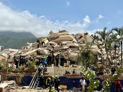 Equipo de rescate de Colombia USAR COL-1 rescata al niño Moisés tras el temblor en Venezuela (Cortesía: UNGRD)