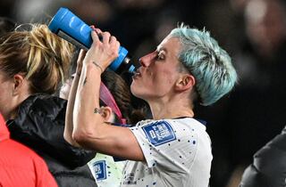 USA's forward #15 Megan Rapinoe drinks water during the Australia and New Zealand 2023 Women's World Cup Group E football match between Portugal and the United States at Eden Park in Auckland on August 1, 2023. (Photo by Saeed KHAN / AFP)