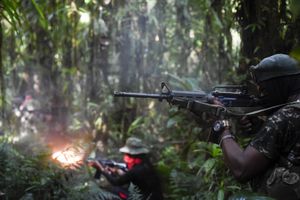 Members of the Ernesto Che Guevara front, belonging to the National Liberation Army (ELN) guerrillas, shoot during a training in the Choco jungle, Colombia, on May 26, 2019. The ELN or National Liberation Army is Colombia's last rebel army and one of the oldest guerrillas in Latin America. (Photo by Raul ARBOLEDA / AFP)