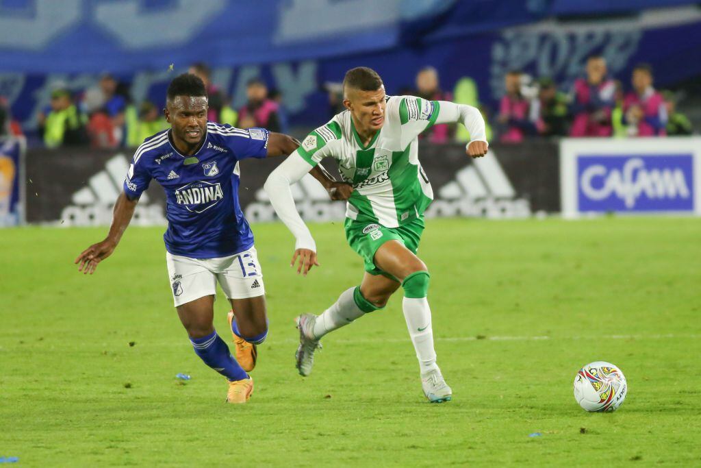 Elvis Perlaza of Millonarios F. C. and Nelson Deossa of Atletico Nacional fight for the ball during the second leg of the final of the BetPlay DIMAYOR I 2023 League played at the Nemesio Camacho El Campin stadium in Bogota. (Photo by Daniel Garzon Herazo/NurPhoto via Getty Images)