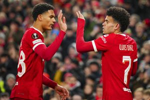Liverpool's Luis Diaz, right, is congratulated by Cody Gakpo after scoring his side's opening goal during the Europa League Group E soccer match between Liverpool and LASK, at the Anfield stadium in Liverpool, England, Thursday, Nov. 30, 2023. (AP Photo/Jon Super)