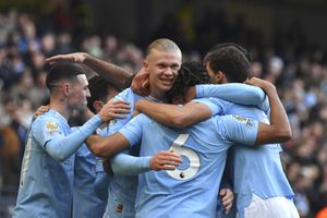 Manchester City's Erling Haaland, centre, celebrates with teammates after scoring his side's opening goal during the English Premier League soccer match between Manchester City and Liverpool at Etihad stadium in Manchester, England, Saturday, Nov. 25, 2023. (AP Photo/Rui Vieira)