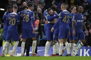 Chelsea's Noni Madueke, left, celebrates with teammates after scoring his sides sixth goal during the English League Cup semi final second leg soccer match between Chelsea and Middlesbrough at the Stamford Bridge stadium in London, England, Tuesday, Jan. 23, 2024. (AP Photo/Kin Cheung)