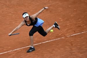 Colombia's Maria Camila Osorio returns to France's Caroline Garcia during their round of 32 match at the Women's WTA Rome Open tennis tournament on May 13, 2023 at Foro Italico in Rome. (Photo by Filippo MONTEFORTE / AFP)